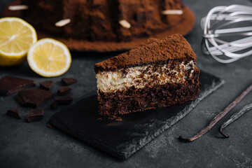 Vanilla and chocolate cake on black board