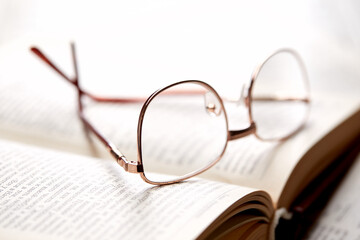 glasses on the book pages