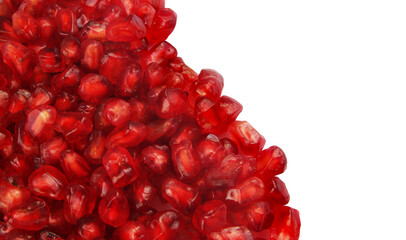Pomegranate seeds on white background with copy space.