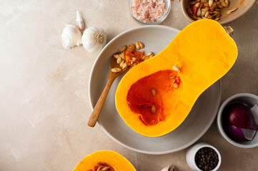 Butternut squash cutted in halves pumpkin, cooking autumn pastry or soup.