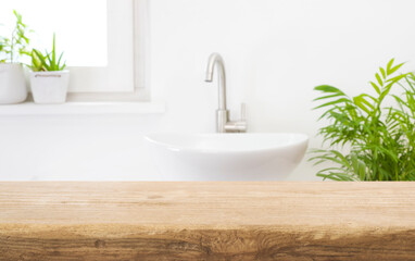 Fototapeta na wymiar Table top for product display and blurred bathroom washstand background