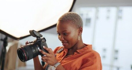 Success, happy and photographer celebration by black woman excited with her photography and results at a design studio. Happy, victory and cheering professional express positivity looking at camera