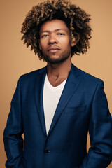 Black businessman in jacket in studio