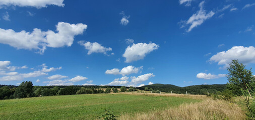 A beautiful panorama of the Dry Mountains near Wałbrzych on a sunny summer day.
