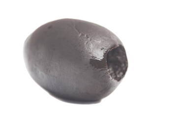 one whole black olive isolated on white background