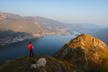 Fototapeta na wymiar the alps, lakes and cities of brianza seen in the sunset light from the top of mount Barro, near the town of lecco, Italy - April 2022.