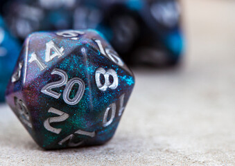 Dungeons and Dragons and the famous 20sided dice with selective focus with copy space