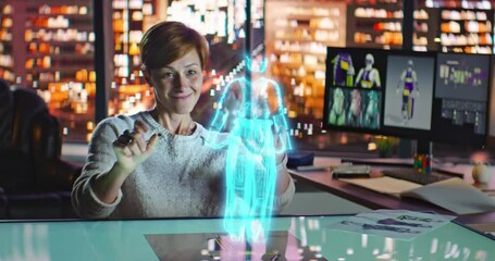 Female Fashion Designer Working with Holographic Augmented Reality 3D Model. Young Woman Creating New Clothing Collection. Artificial Intelligence. Fashion and Art Concept. - Powered by Adobe