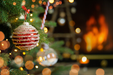 Festive bright Christmas ornaments on fireplace background.