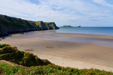 Almost deserted Rhossili beach at low tide.