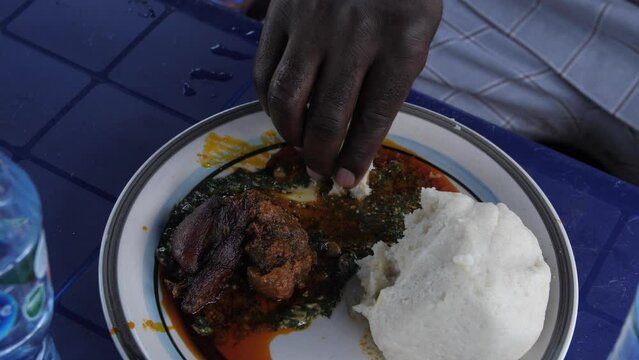 Africa Nigeria local popular dishes known as ewedu and eba .