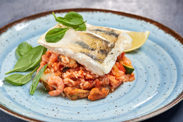 white fish with rice and vegetables