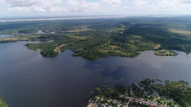 Drone capture the river of Amazon flowing near the city of Parintins, Brasi and the city which is settled at the edge