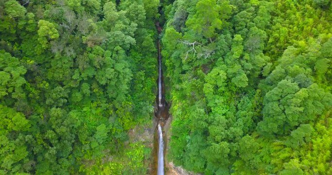 Aerial dolly out revealing double waterfall of Ribera Quente in the jungle of Sao Miguel island, Azores