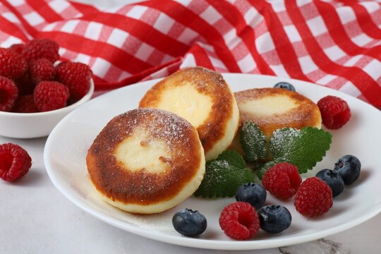 Curd Fritter With Berries In A Plate. Cottage Cheese Fritters.