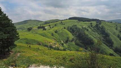 Fototapeta na wymiar Panoramic views from Bolshoye Sedlo mountain to the Kislovodsk National Park and the city of Kislovodsk, North Caucasus, Russia.