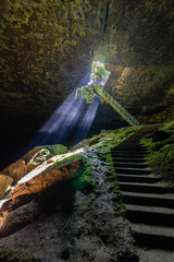 Between heaven and hell concept. The stair cave near Lovech, Bulgaria.