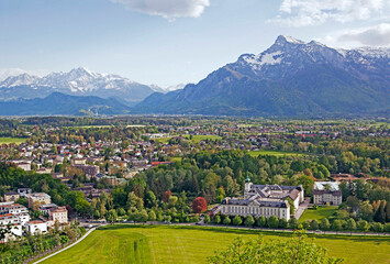 Aerial view of the skyline of Salzburg against the Austrian Alps