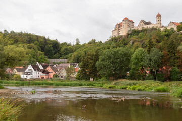 Fototapeta na wymiar River Wörnitz overlooking medieval Harburg Castle in Bavaria's picturesque small town of Harburg; Germany.