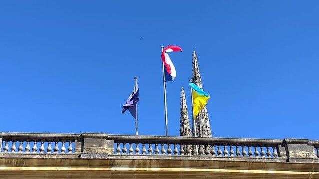 France, Ukraine and Europe flags waving at the entrance of the Palais Rohan, Bordeaux city hall