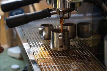 Fototapeta na wymiar Making strong coffee in a carob coffee machine