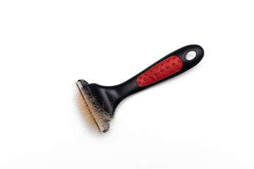 Obraz premium comb for combing wool from animals on a white background