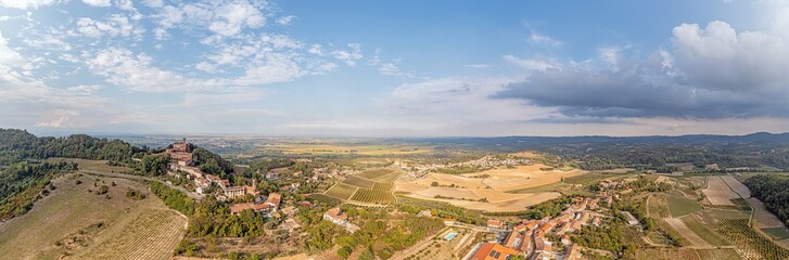Drone view over the Po Valley from the mountains of Piedmont from the village of Camino during the day