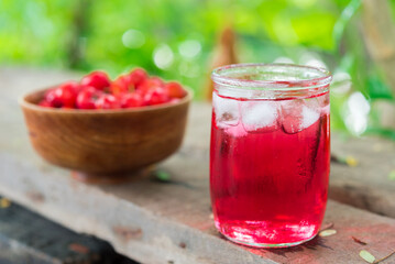 Glass of sour cherry juice with fresh red cherries, Cherry juice, on wood background, red drink, High vitamin C and antioxidant fruits.