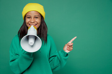 Little kid teen girl of African American ethnicity 13-14 years old wear hoody hat hold scream in...