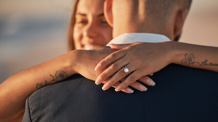 Wedding, love and couple hug with ring, happiness and celebration for life partnership, bond and...