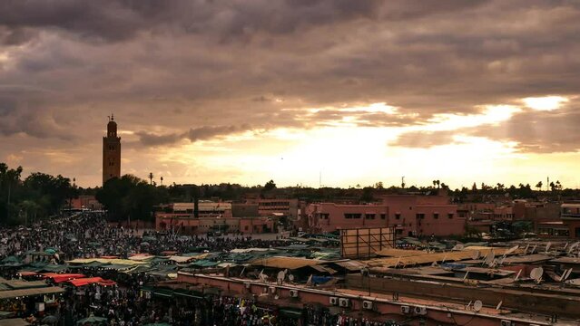 TimeLapse of sunset Morocco, Marrakech Jemaa el-Fnaa. People moving in crowd