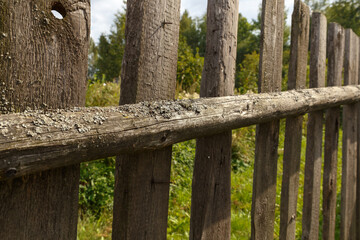 old wooden fence from boards. Fence element close-up.