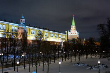 Fototapeta na wymiar Spasskaya tower and winter Kremlin against the backdrop of street Christmas decorations.