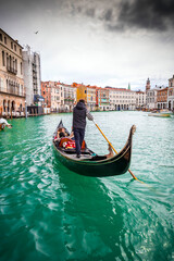 Fototapeta premium Gondolas on the ancient canals of Venice, Italy