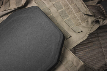 Ballistic insert for body armor. Armored insert for a bulletproof vest. Body armor close-up.