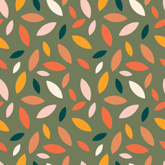 Autumn leaf fall on a green background. Seamless cute pattern with leaves or grains in different colors. Vector.
