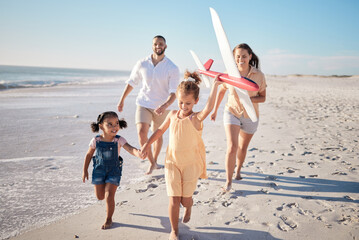 Hawaii, happy family and beach with happy children running, toy airplane and freedom together. Travel, wellness and energy with excited kids run and have fun, laugh on fun activity with mom and dad
