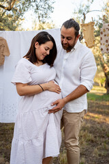 Happy young couple expecting baby. Pregnancy and parenthood concept.