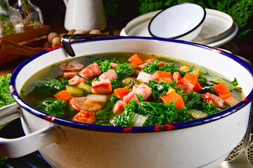 autumnal kale soup with sausage and bacon cubes