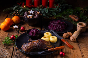 Roast goose with baked apples, red cabbage and dumplings