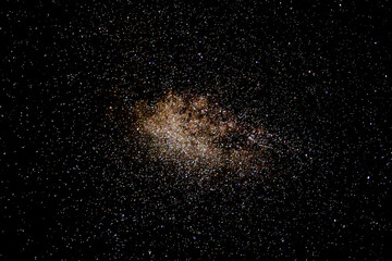 Fototapeta na wymiar Milky way galaxy and fiery starry sky. Beautiful sky with shining stars and star trails