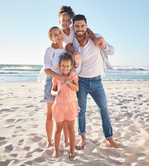 Fototapeta na wymiar Family, portrait and happy smile on the beach with children and parents on sand in the sun. Summer fun of kids, mother and man by the ocean water and waves with happiness and quality time in nature