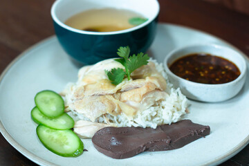 Rice steamed with chicken soup  with cucumber, liver and sauce for sale 