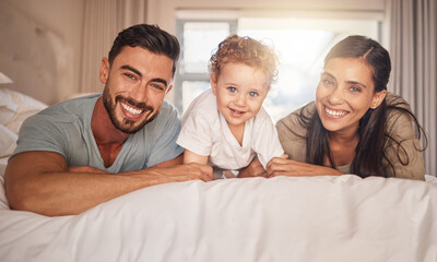 Mother, father and child bonding in bedroom happy, love and care together in morning at family home. Portrait of joy, excited and young parents of mom, dad and youth son smile with happiness at house