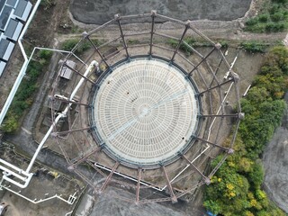 aerial photo of an industrial Steel structure, empty victorian gas storage tank for bulk storage of...