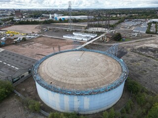 aerial photo of an industrial Steel structure of empty 1960s gas storage tank for bulk storage of...