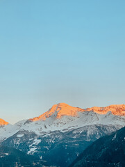 snowy mountains in the winter with a blue sky the alps ski snowboard un sunset 