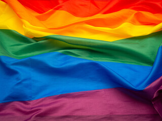 Top view of the rainbow flag or LGBT flag. Full frame photo