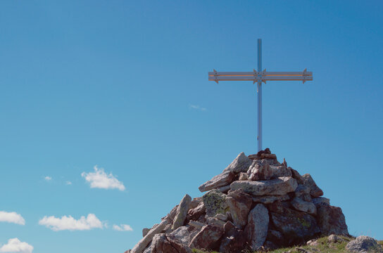 Cross on the top of mount Cima Venina, Lombardy, Italy 