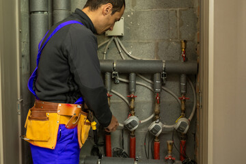 Fototapeta premium Handsome young man builder installing